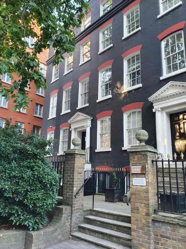 Historic black facade of The Pilgrim Suite, ideal for corporate events and private functions.