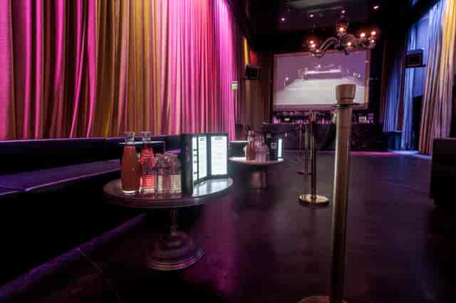Stylish Lin Lounge event space with vibrant drapery, ideal for upscale gatherings and celebrations.