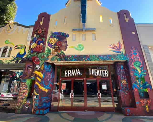Vibrant Brava Theater exterior with colorful murals for unique events and cultural celebrations.