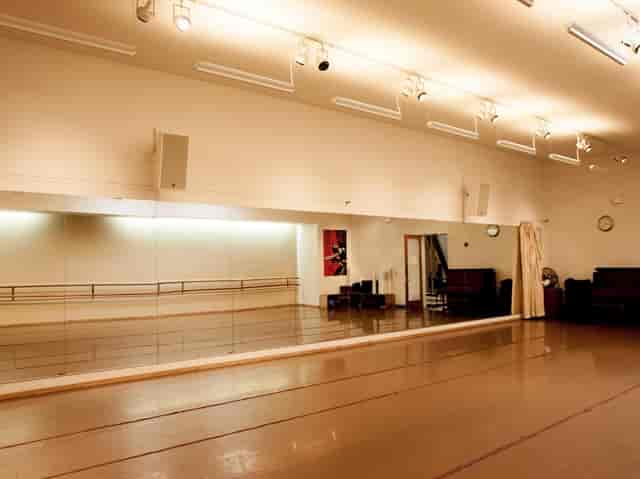 Spacious dance studio with mirrors for workshops and fitness classes at ODC Theater.