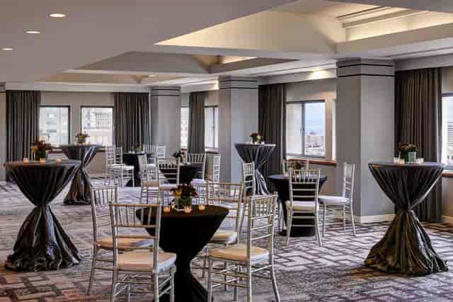 Elegant Union Square Ballroom with round tables, perfect for networking events and receptions.