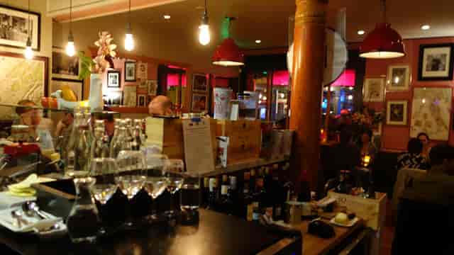 Intimate wine bar in InoVino with warm lighting, ideal for networking events and gatherings.