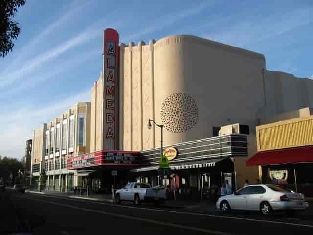 Vintage Alameda Theatre with retro marquee, perfect for unique events and gatherings.