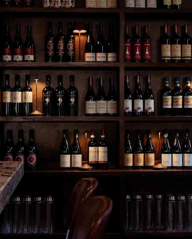 Wine display at 54 Mint Cucina Romana, ideal for tastings and events.