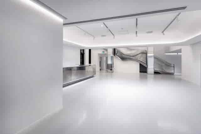 Modern minimalist event space, reception desk, lighting, adaptable venue
