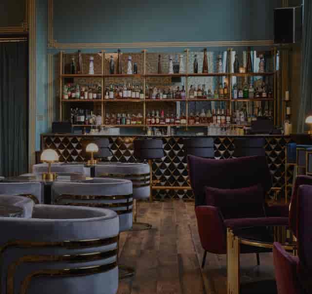 Stylish Mirror Bar in Arlo Williamsburg, perfect for upscale networking events and receptions.