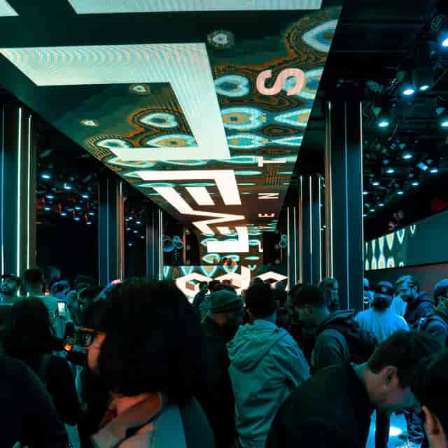 Vibrant dance floor in Shimmytown with dynamic lighting for networking events.