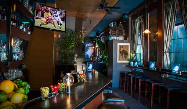 Stylish Club Raven bar with ambient lighting for networking events and casual gatherings.