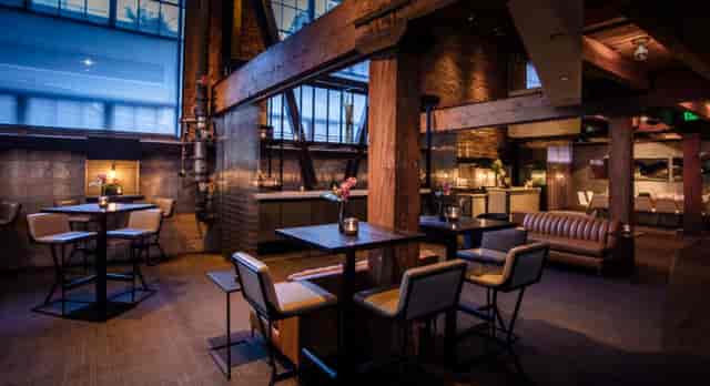 Stylish industrial-chic event space at Restaurant + Social for private dinners and receptions.