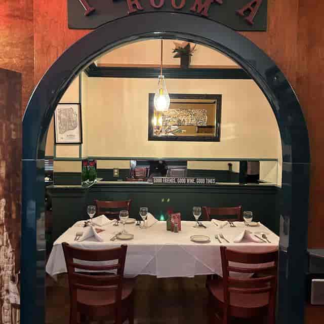 Private dining room with elegant table setting for intimate meetings and events.