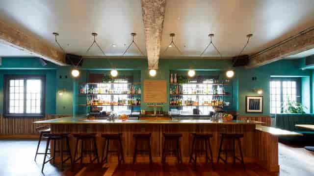 Stylish bar in Green Room, August Hall for networking events and cocktail receptions.