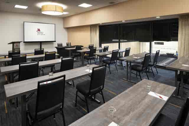 "Suite 105 at OCC Conference Center: bright meeting room for workshops and presentations."