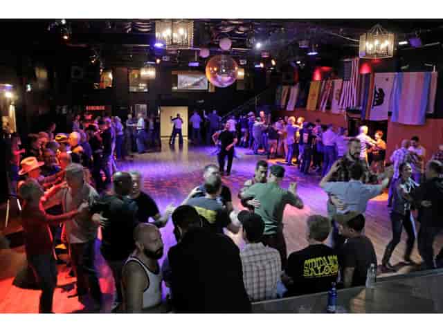 Vibrant Loft at Sundance Saloon with colorful lighting for social events and dancing.