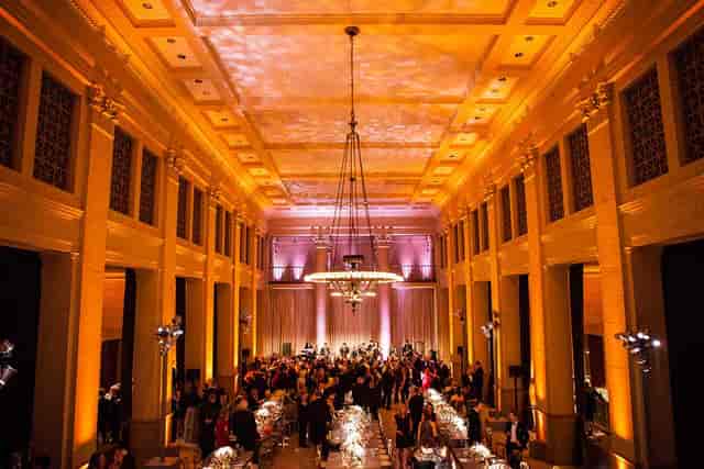Elegant event venue in THE CENTER SF with warm amber lighting for corporate gatherings.