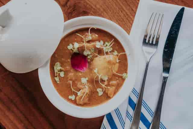 Elegant dish with flower garnish at Castro Indian Restaurant & Bar for events.