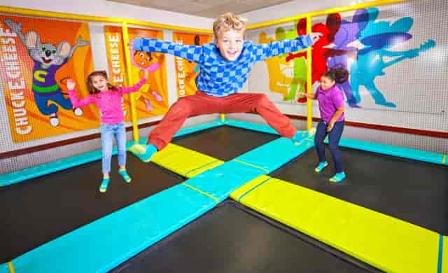 Indoor trampoline zone at Chuck E. Cheese Burbank for kids' birthday parties and events.