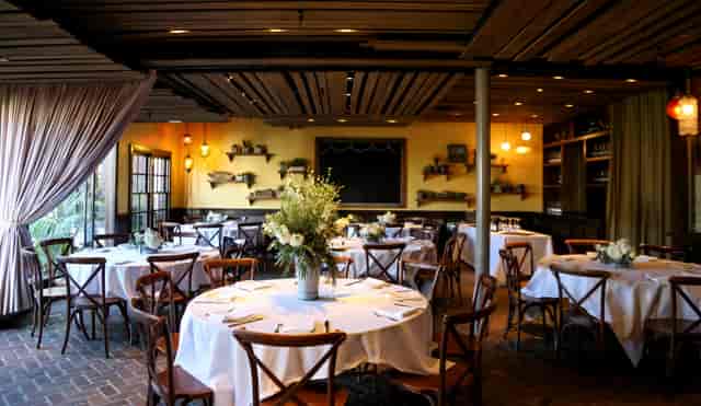 Elegant patio dining space at Tin Roof Bistro for intimate gatherings and corporate events.