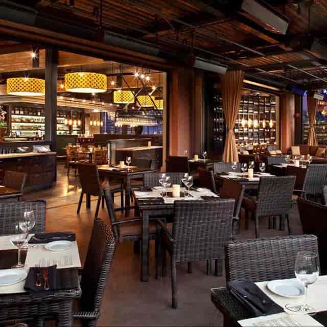 Heated patio lounge at Paul Martin's Grill, ideal for upscale events and corporate gatherings.