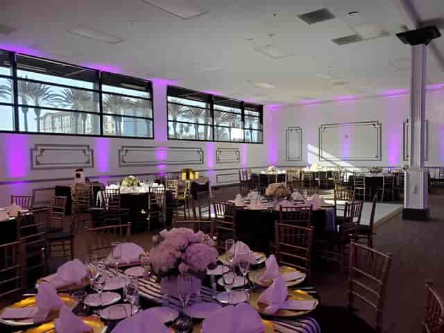 Elegant Rose Room event space with floral centerpieces, ideal for weddings and corporate events.