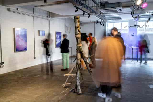 Dynamic art exhibition space with unique installations for networking events.
