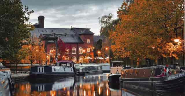 Upstairs Bar at The Wharf: scenic waterfront venue with autumn foliage for events.