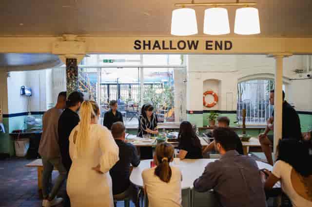 Collaborative meeting at Wallacespace St Pancras, featuring natural light and team-building.