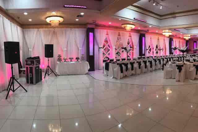 Elegant Sepan Banquet Hall ballroom with pink lighting, perfect for weddings and events.