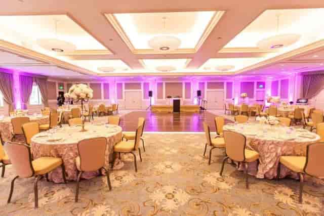 Elegant event space with floral centerpieces, perfect for weddings and corporate gatherings.