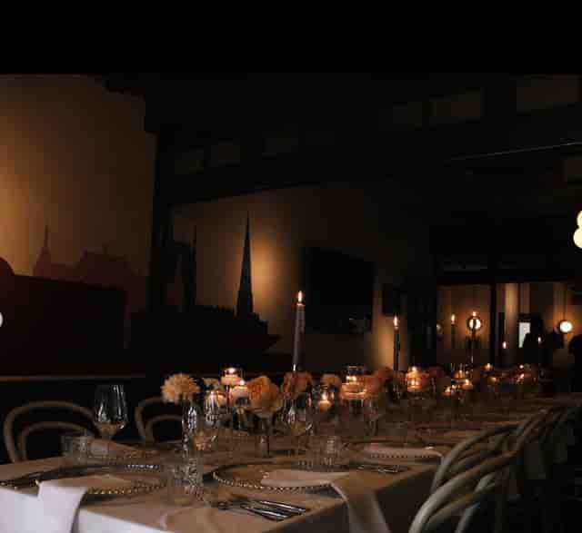 Elegant dining table with candlelight in The Furnace for corporate dinners and events.