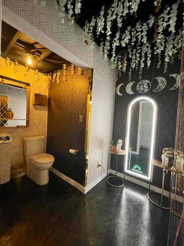 Stylish event restroom with modern decor and elegant lighting at Golden Occasions Venue.