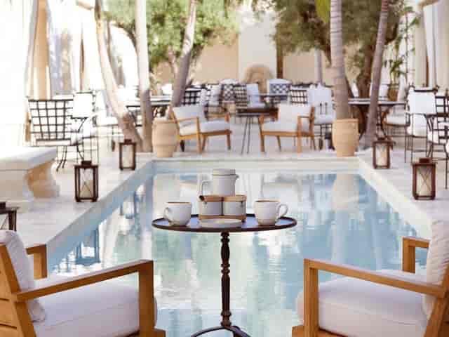 Serene poolside venue at Cara Hotel for networking events and casual meetings.