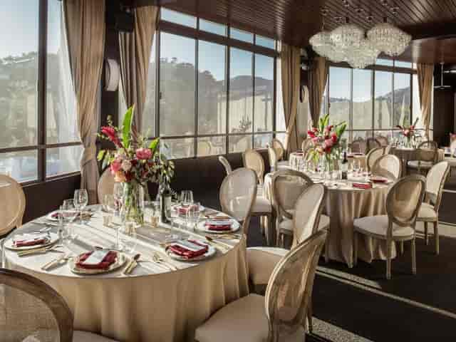 Elegant multi-room event space with floral centerpieces for upscale meetings and celebrations.