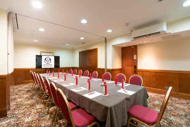 Duke Boardroom setup with red pens for professional meetings in London Kensington.