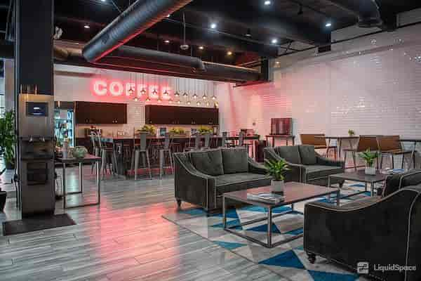 Modern lounge area on 16th floor, perfect for networking and casual meetings.