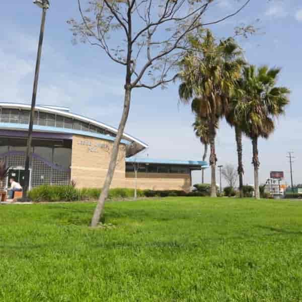 Jessie Owens Park: modern venue with greenery, ideal for outdoor events and networking.