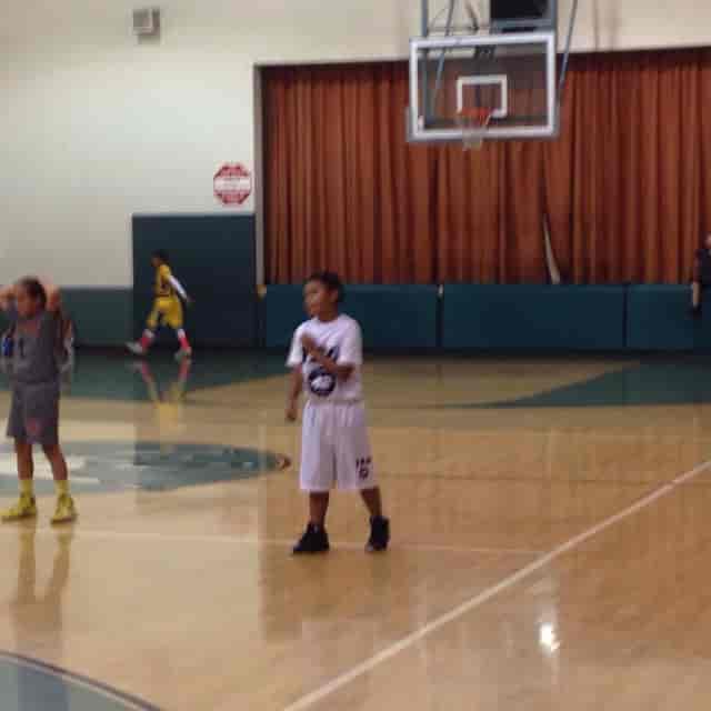 Basketball court at Victory Vineland Recreation Center for youth sports event.