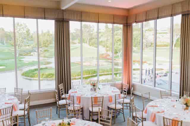 Elegant banquet room with floral centerpieces, perfect for weddings and corporate events.