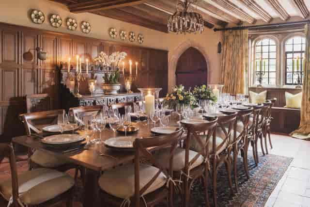 Elegant dining room in Battel Hall, Leeds Castle, ideal for upscale events and gatherings.