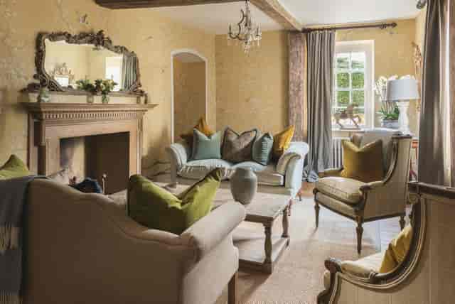 "Battel Hall meeting space at Leeds Castle, featuring plush seating for intimate gatherings."