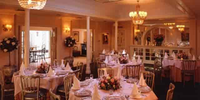 Elegant dining room with floral centerpieces, perfect for weddings and formal events.