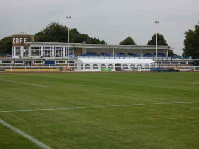 Main Stand Seating at Enfield Town FC, ideal for events with a white marquee and café.