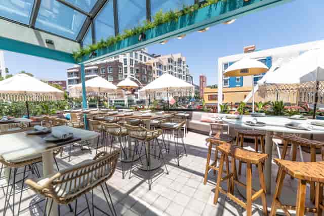 Vibrant rooftop lounge at Caribe Restaurant, perfect for events and gatherings.