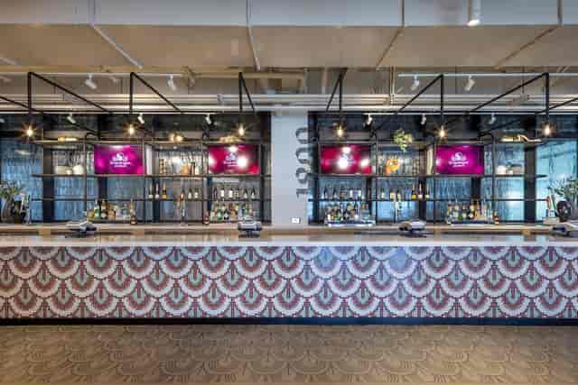 Stylish event space with bar in Snapdragon Stadium for networking and receptions.