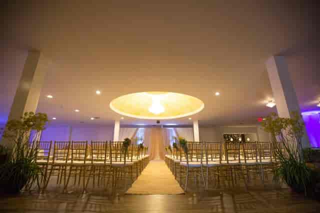 Elegant Encanto event space with chiavari chairs, perfect for weddings and gatherings.