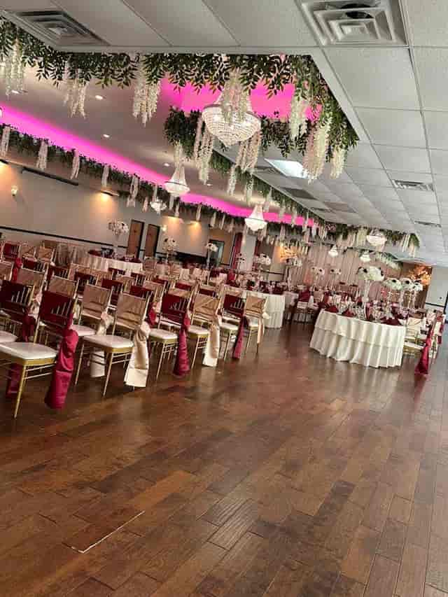 Elegant wedding venue with burgundy decor and floral centerpieces in Boulevard Hall.