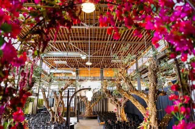 Elegant event space with floral decor, perfect for weddings and corporate gatherings.