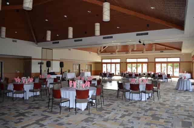 Dance studio in Coronado Community Center with elegant round tables for events.