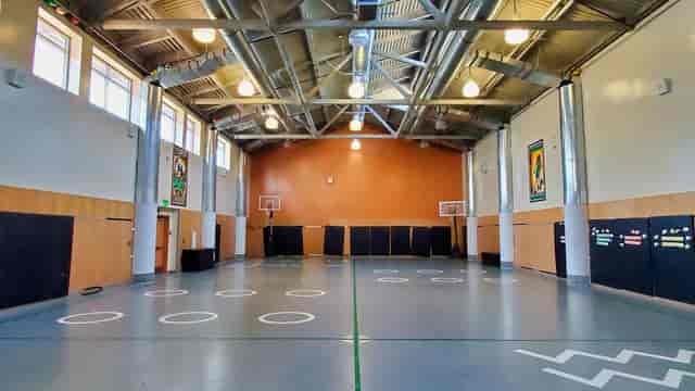 Gymnasium at Golden Hill Recreation Center with high ceilings, ideal for events and meetings.