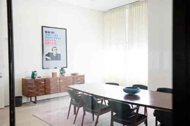 Modern Executive Boardroom with wooden table, ideal for meetings and brainstorming.
