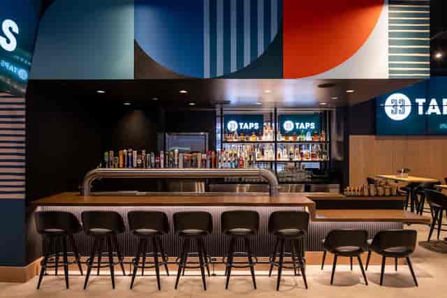 Modern bar in Downtown LA with vibrant decor, ideal for networking events and gatherings.